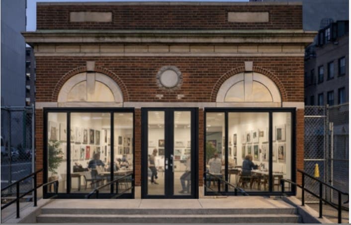 Rendering of the entrance facade at dusk, glowing from inside